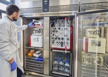 Technician operating AKTA System